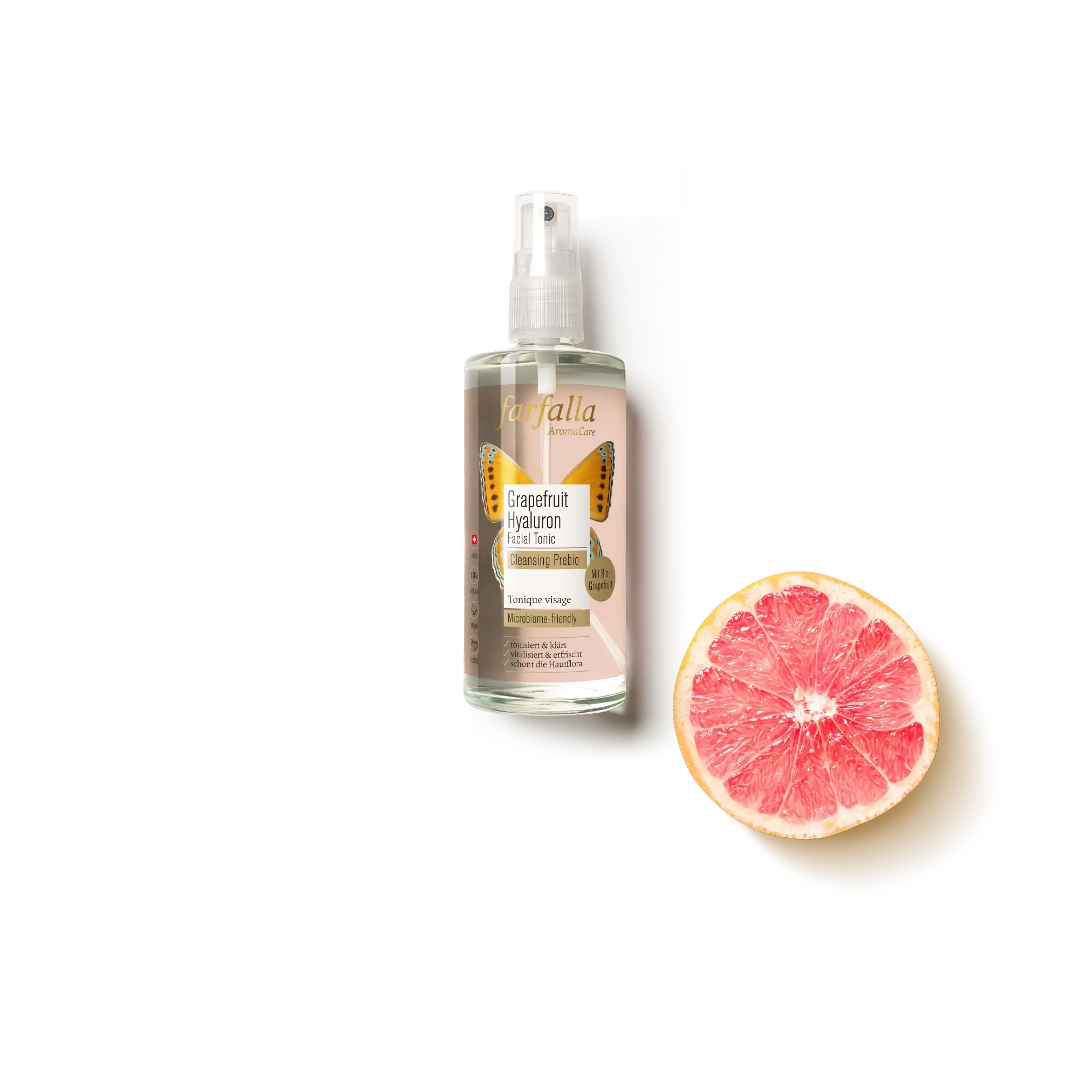 farfalla Grapefruit Hyaluron Facial Tonic Flasche neben halbierter Grapefruit, Galerie Position 1, Schweizer Aromatherapie